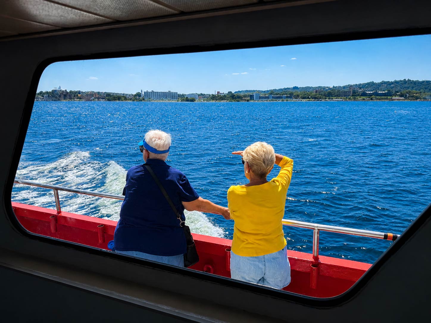 Large windows allow views of the Statue of Liberty during the cruise